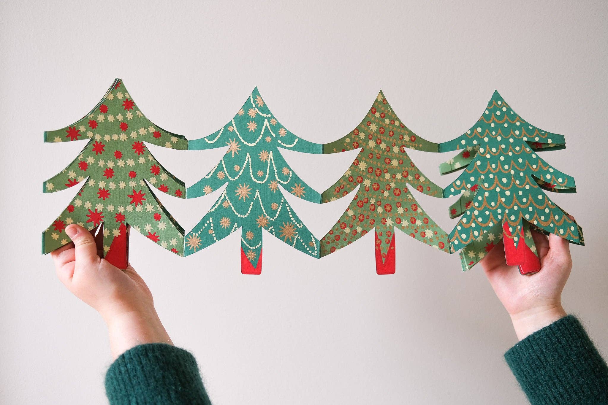 Harmonicaslinger met kerstbomen, uitgevouwen