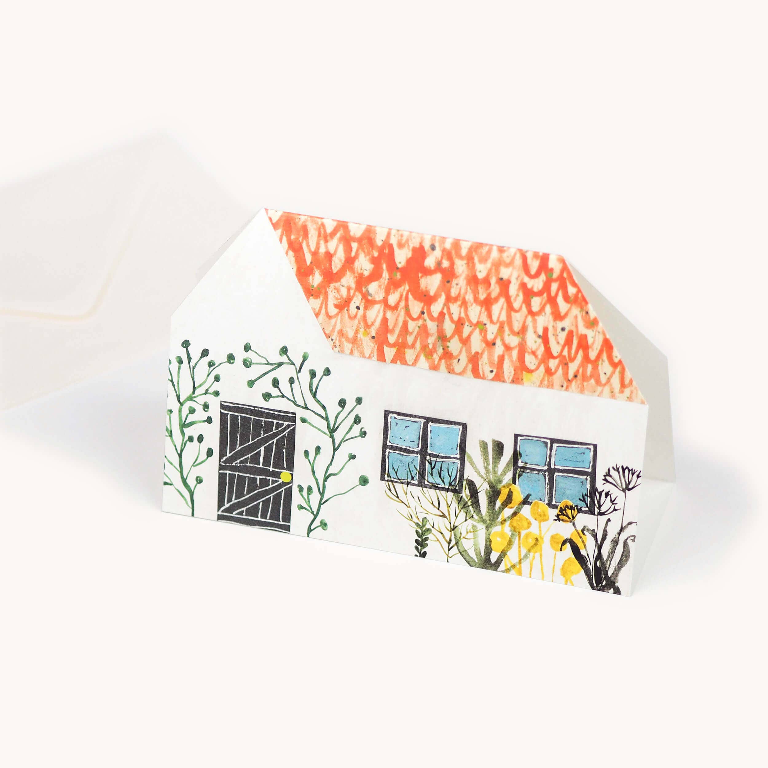 Detail van het huisje met kat in de tuin