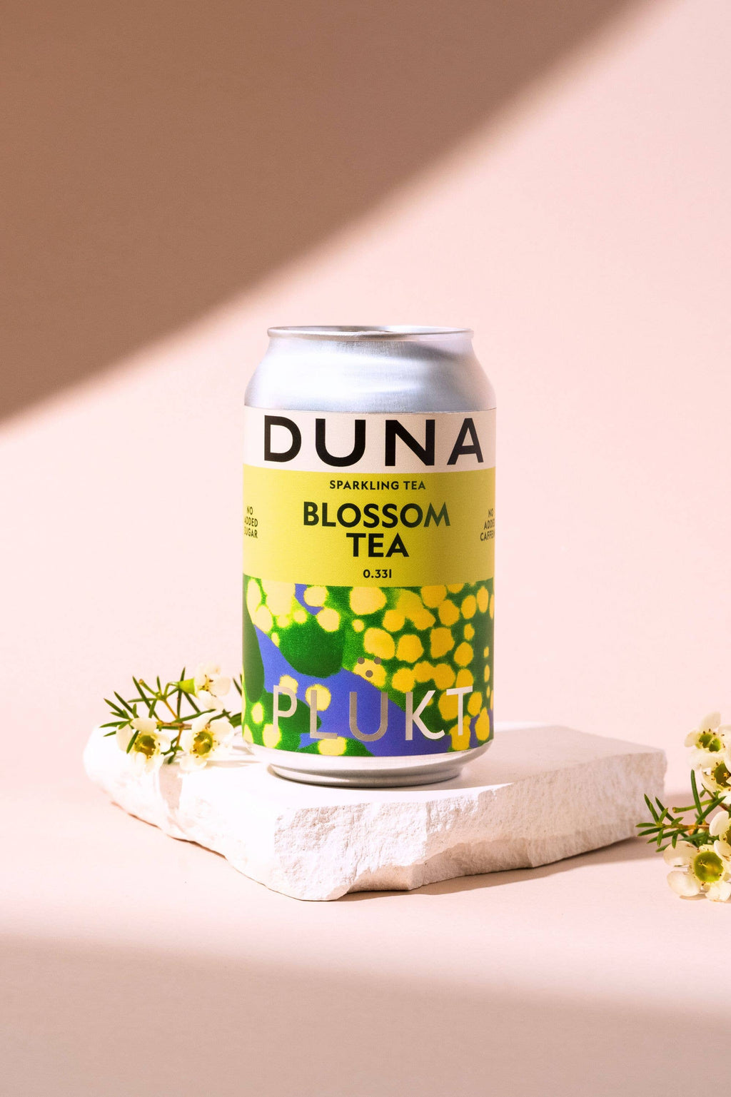 Sprankelende Blossom bloementhee van PLŪKT, blikje 0,33 l
