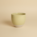 Gele pot warme achtergrond
